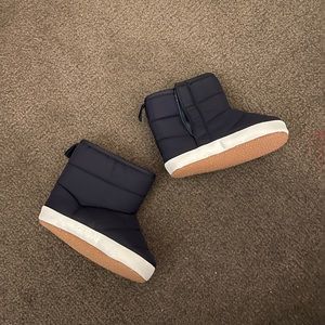 Navy blue water-proof boots.